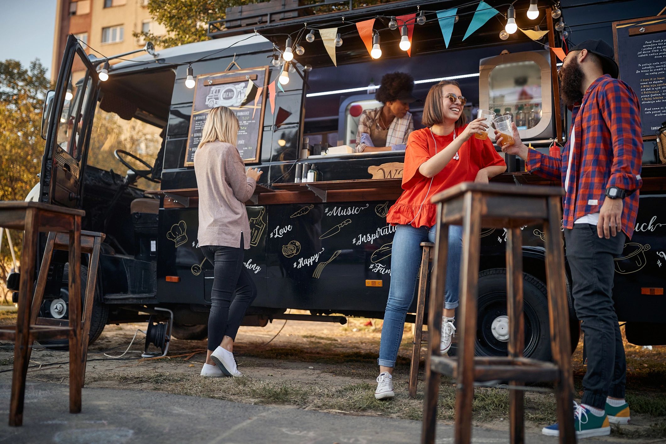 People gathered near a food truck at an outdoor event