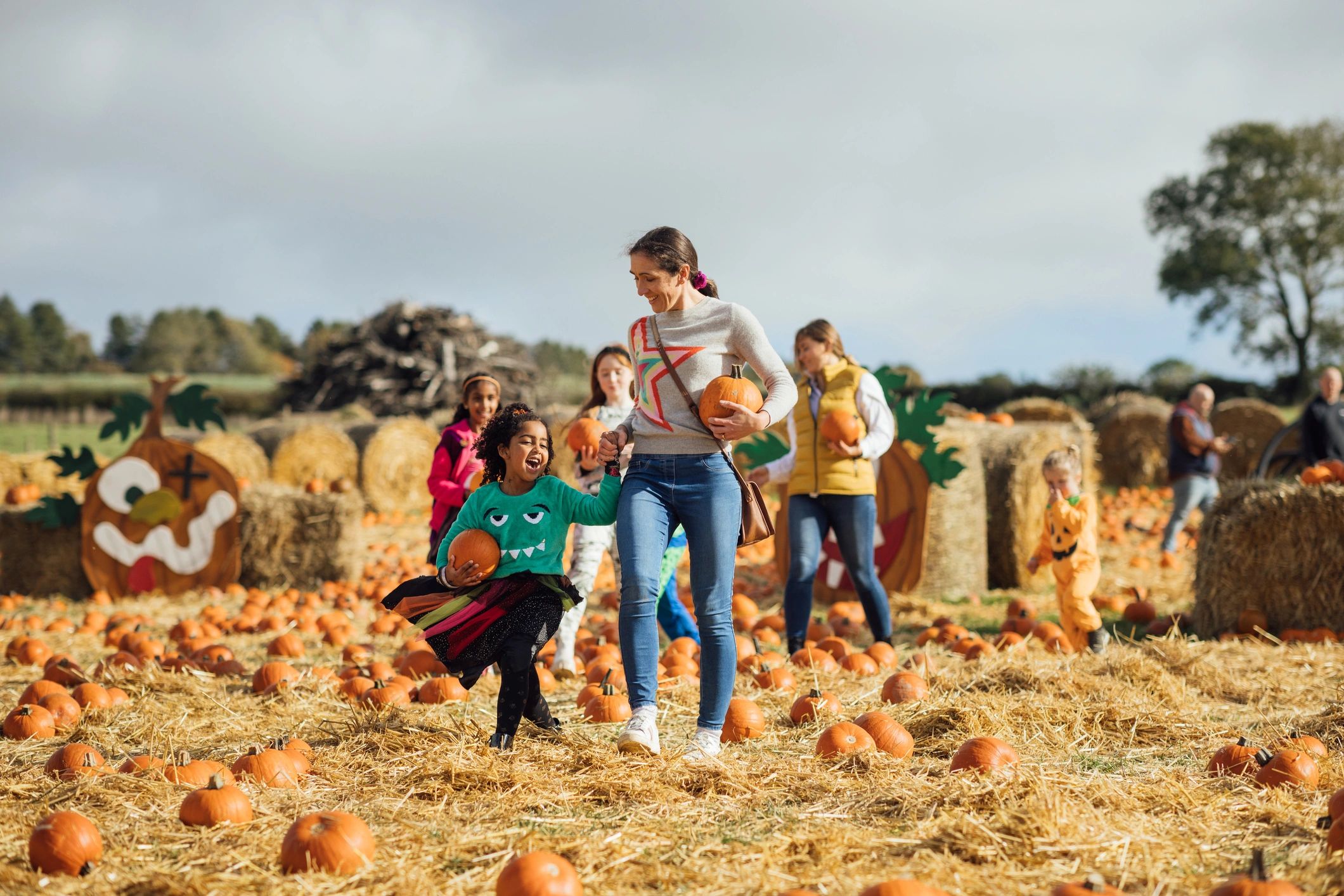 Families enjoying a seasonal farm field outing