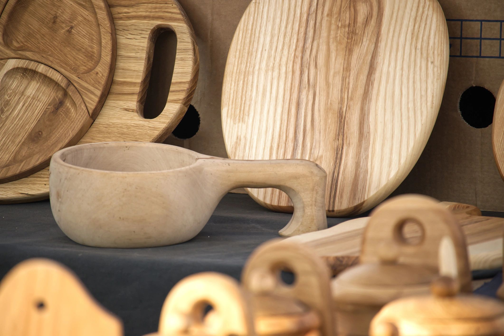 Handcrafted wooden kitchenware arranged on a table